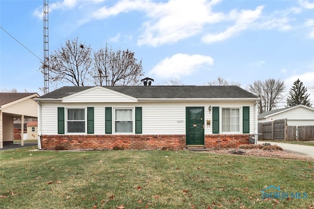 ranch-style house featuring a front yard and a carport