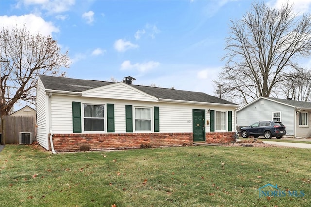 single story home featuring central AC unit and a front yard