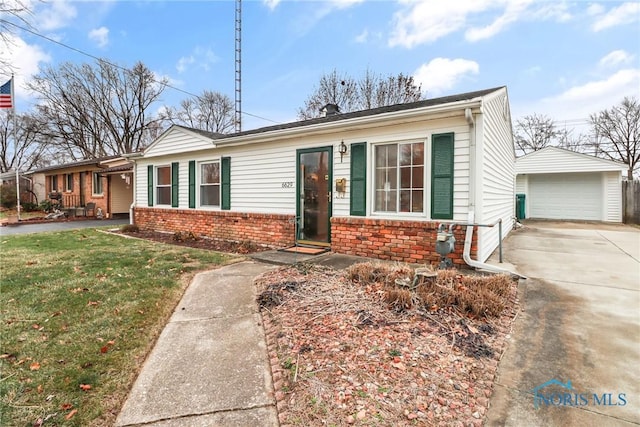 view of front of home with a garage, an outdoor structure, and a front lawn