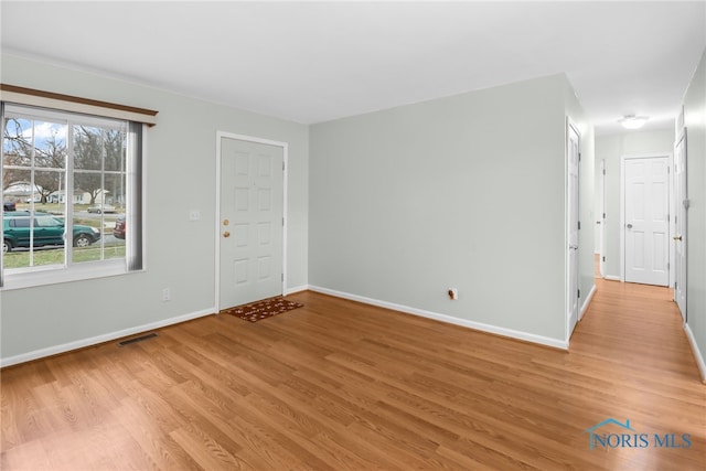 empty room with light wood-type flooring