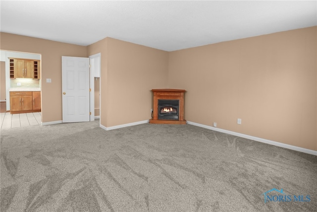 unfurnished living room with light carpet