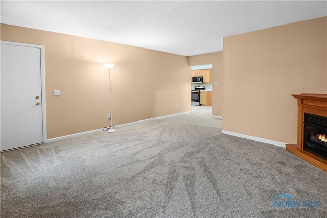 unfurnished living room with light carpet