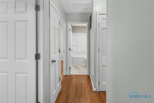 hallway with light wood-type flooring