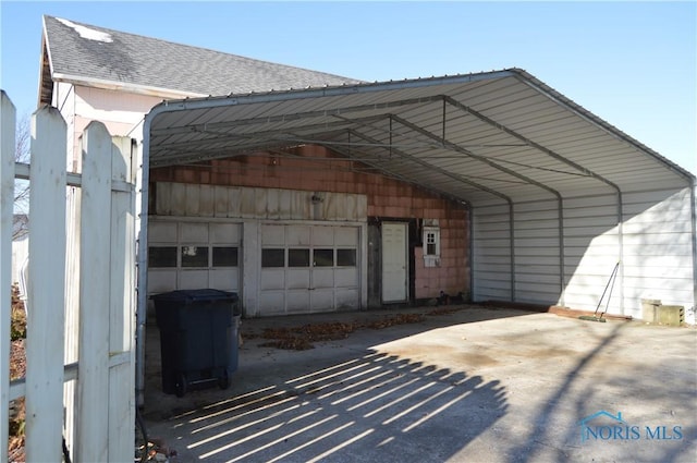 garage featuring a carport