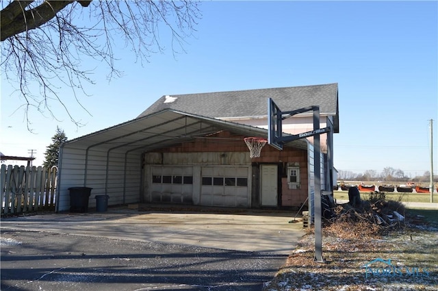 view of side of property featuring a carport