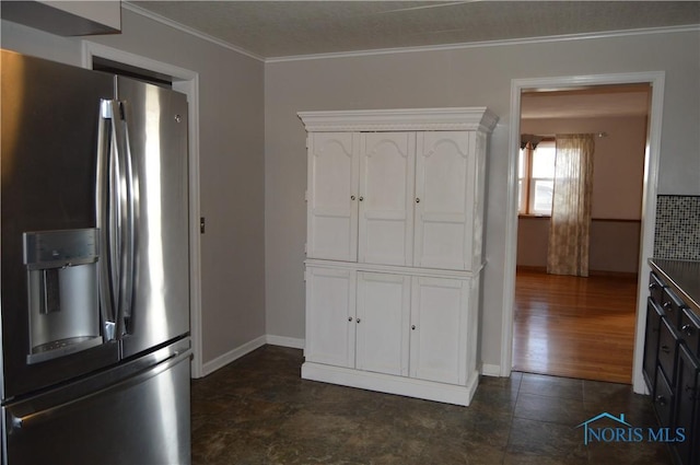 kitchen with stainless steel refrigerator with ice dispenser, a textured ceiling, dark wood-type flooring, crown molding, and white cabinetry