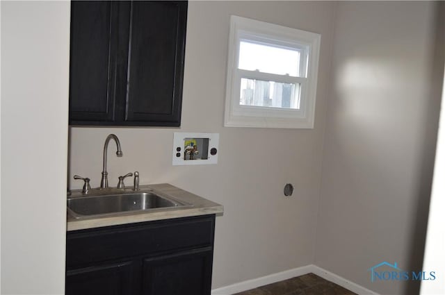 laundry room featuring cabinets, sink, and washer hookup