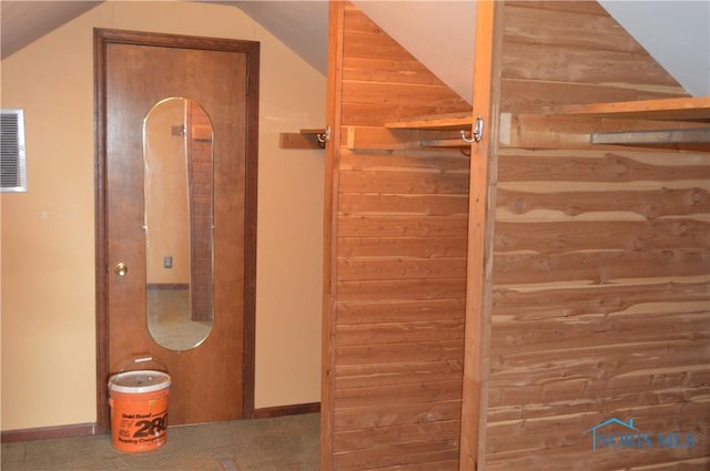 bathroom featuring lofted ceiling