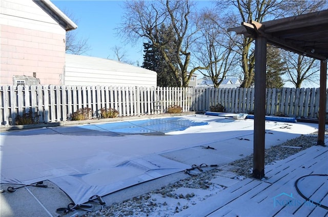 view of snow covered pool