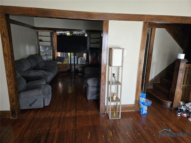 living room with dark hardwood / wood-style floors