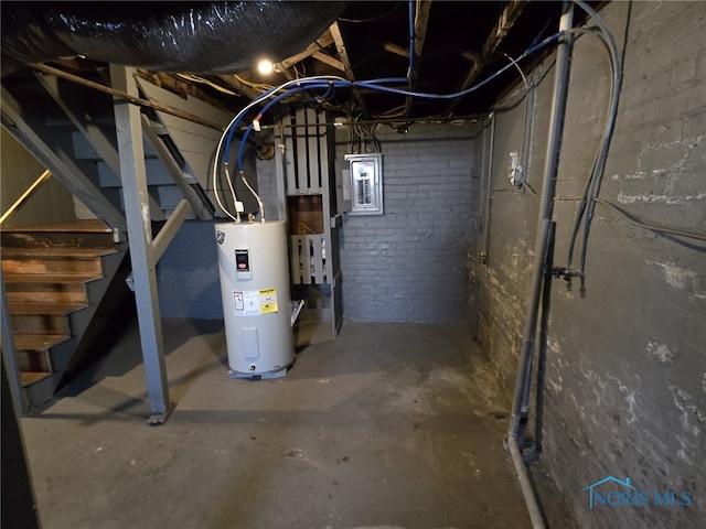 basement with electric panel and water heater