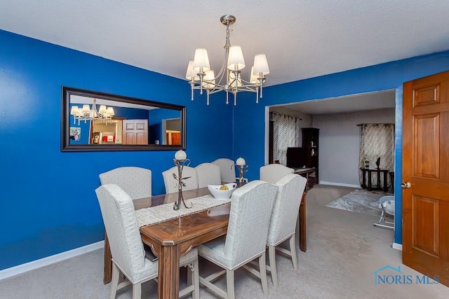 dining area featuring an inviting chandelier