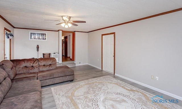 living room featuring light wood-type flooring, ceiling fan, and ornamental molding