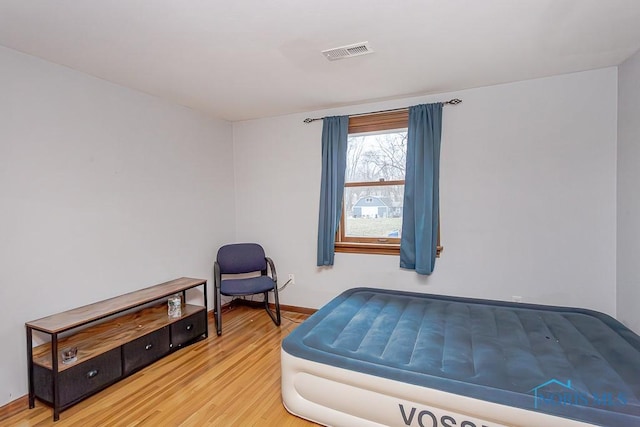 bedroom featuring hardwood / wood-style flooring