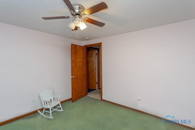 unfurnished room featuring light carpet and ceiling fan