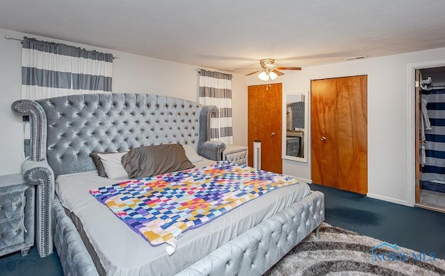 bedroom with dark colored carpet and ceiling fan