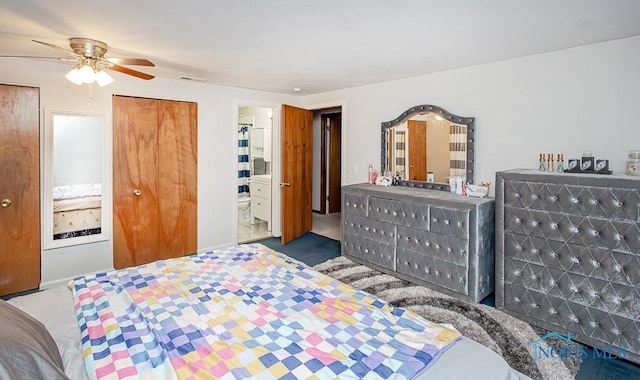 bedroom with carpet, ensuite bathroom, and ceiling fan