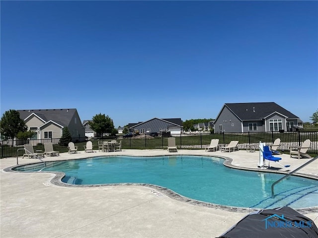 2261 Falling Waters Ln, Perrysburg, OH 43551 - community pool featuring a residential view, fence, and a patio