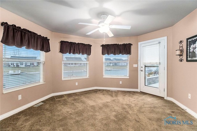 carpeted empty room with ceiling fan