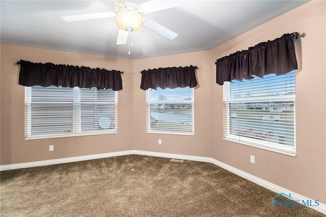 carpeted empty room with ceiling fan