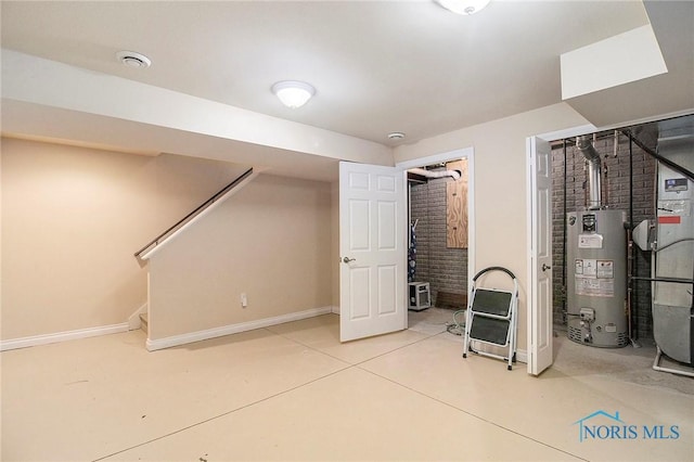 basement with brick wall and gas water heater