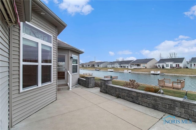 view of patio featuring a water view