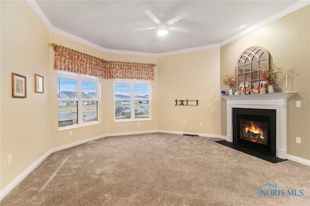 unfurnished living room featuring carpet, ceiling fan, and ornamental molding