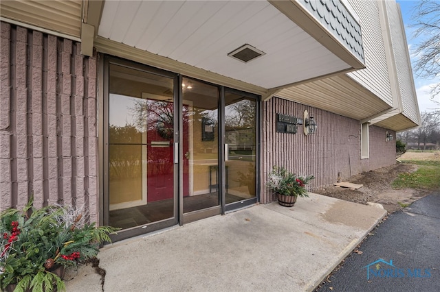 doorway to property featuring a patio