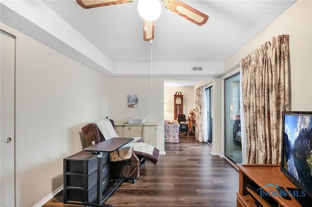 interior space featuring dark hardwood / wood-style floors and a textured ceiling