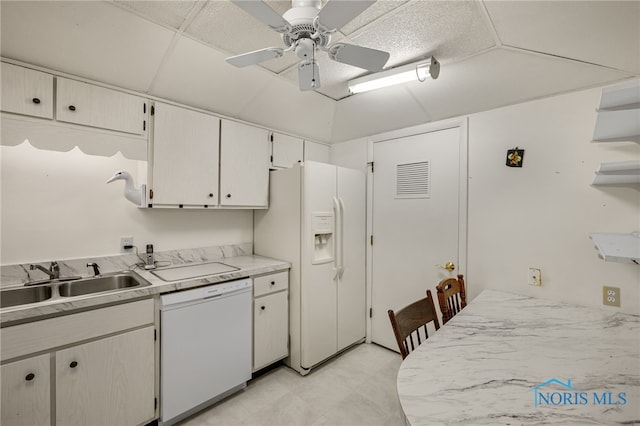 kitchen featuring white cabinetry, ceiling fan, sink, and white appliances