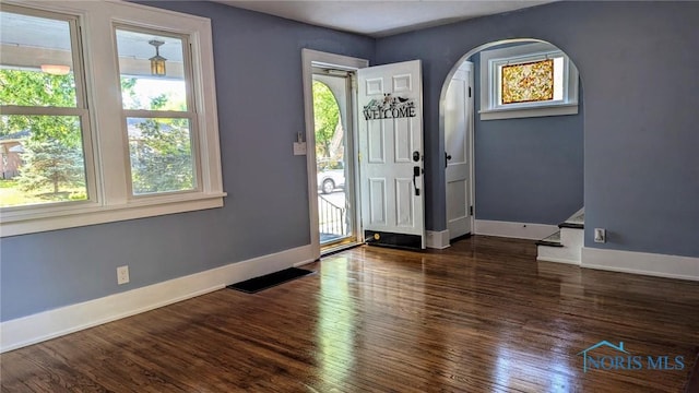 foyer entrance with dark wood-type flooring