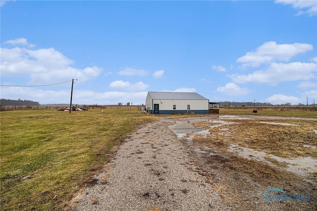 view of yard with a rural view