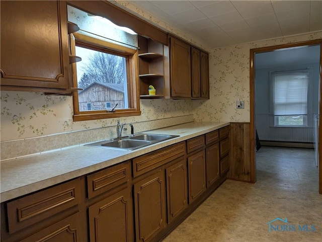 kitchen featuring sink and a baseboard radiator