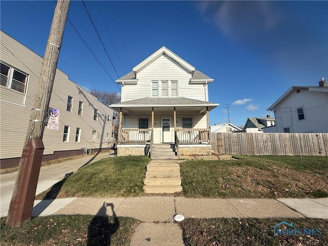 view of front of house featuring a porch and a front yard