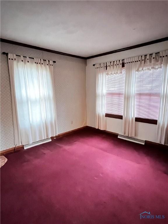 carpeted spare room with crown molding