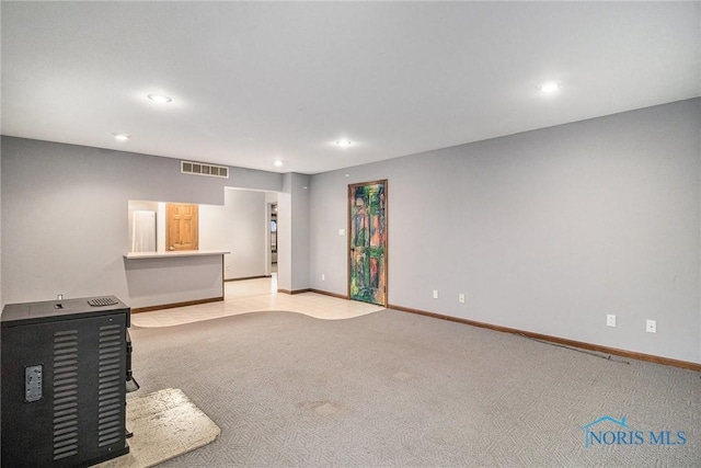 unfurnished living room with light carpet