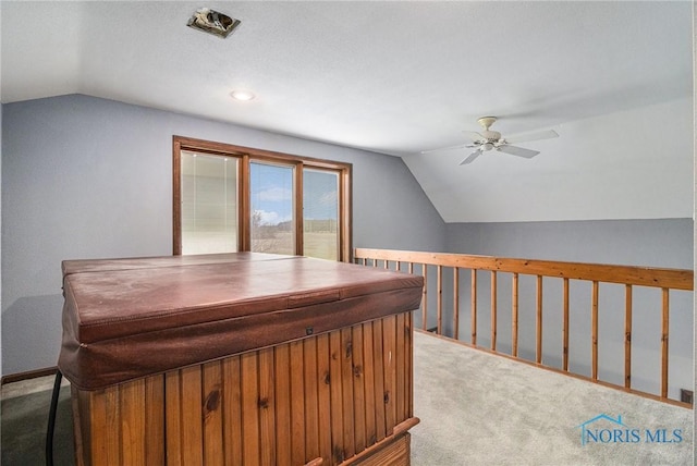 office area featuring carpet flooring, ceiling fan, and lofted ceiling