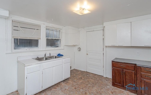 kitchen with white cabinets and sink