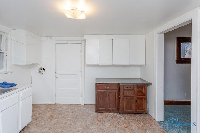 kitchen with white cabinetry