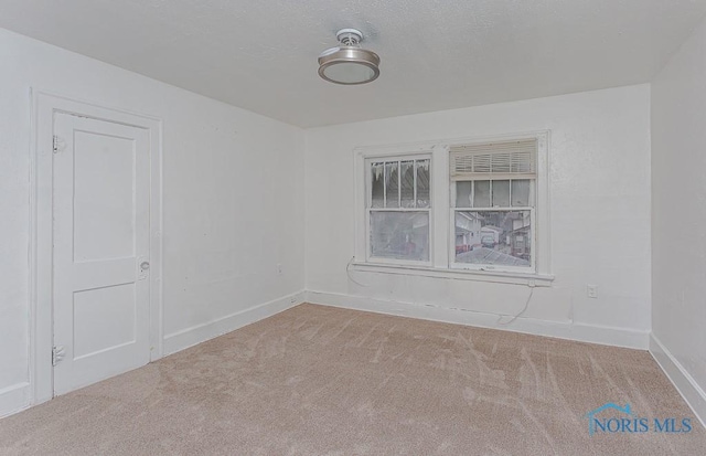 empty room featuring carpet floors