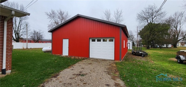 garage featuring a yard