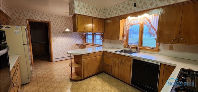 kitchen with dishwasher, sink, a baseboard radiator, white fridge, and kitchen peninsula