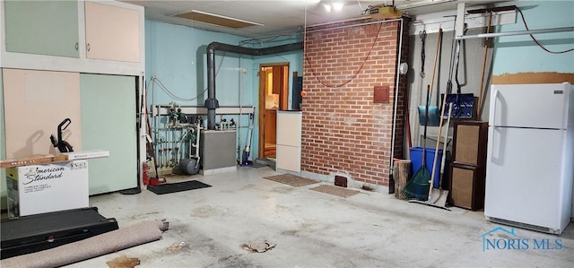 basement featuring white fridge