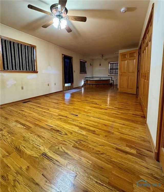 interior space featuring ceiling fan and light hardwood / wood-style flooring