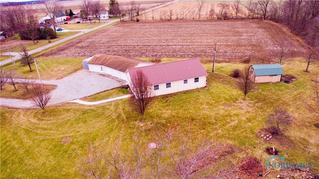 birds eye view of property with a rural view