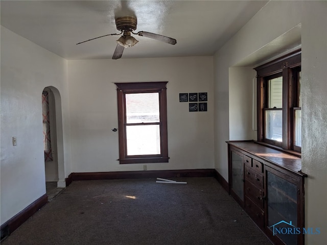 interior space featuring ceiling fan