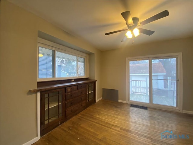 interior space featuring hardwood / wood-style flooring and ceiling fan