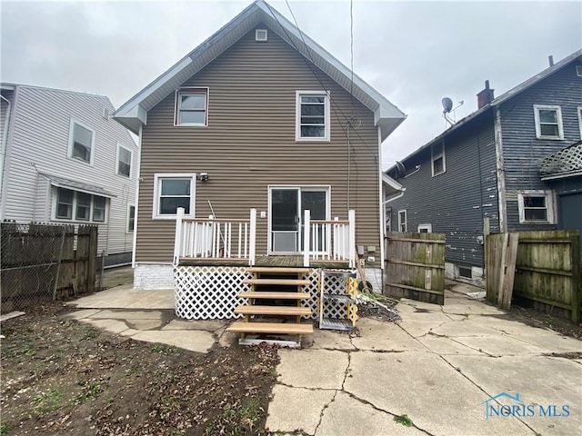 rear view of house featuring a patio