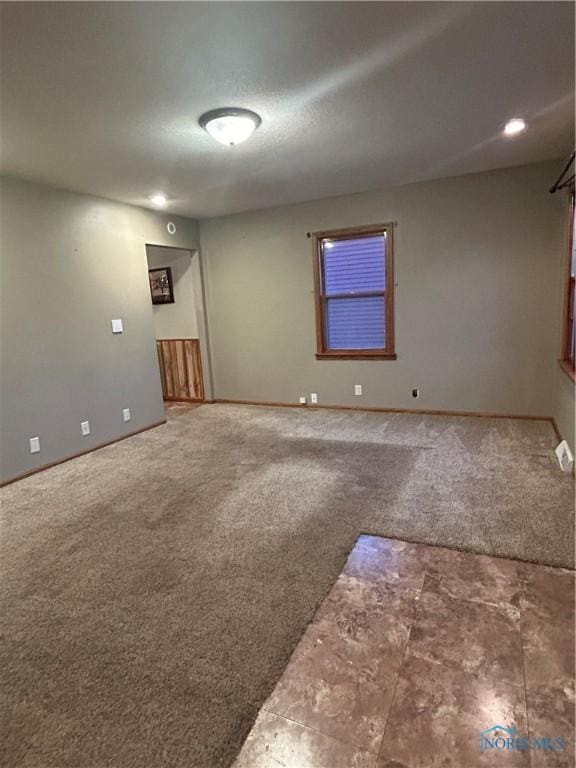 spare room with carpet floors