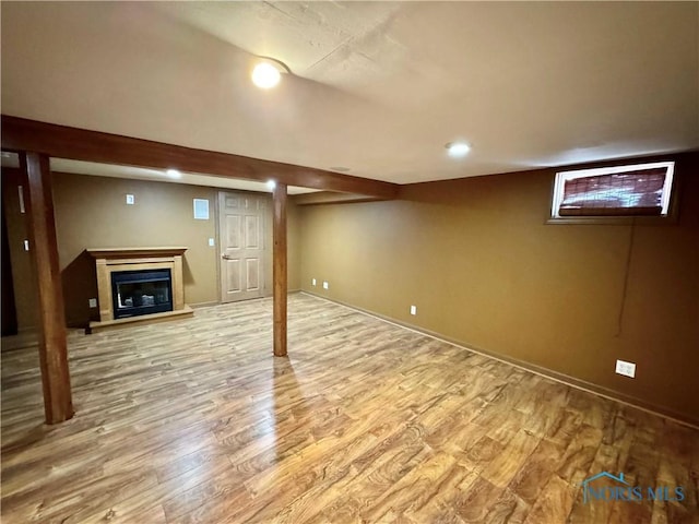 basement featuring light hardwood / wood-style flooring